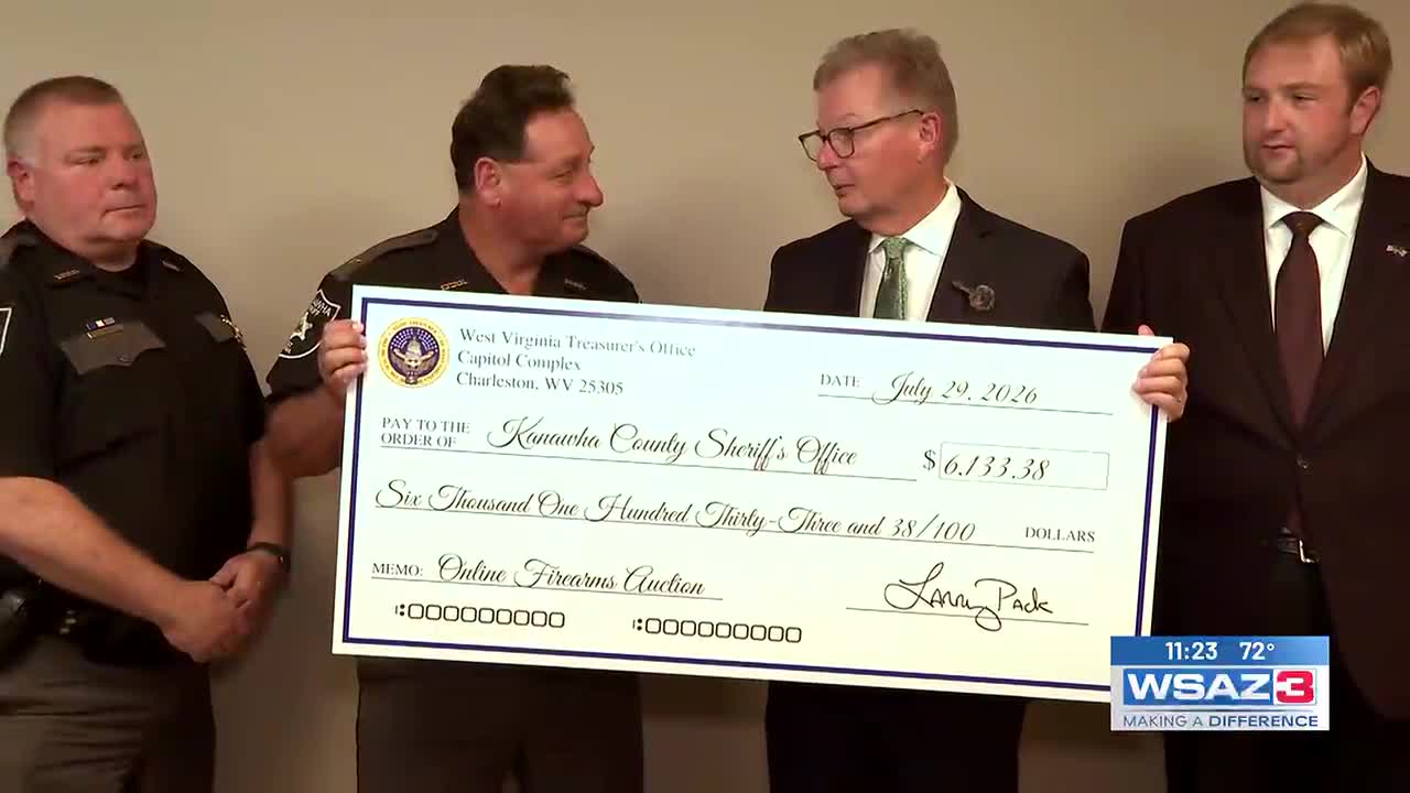More than $6,000 check from gun auction presented to sheriff’s office