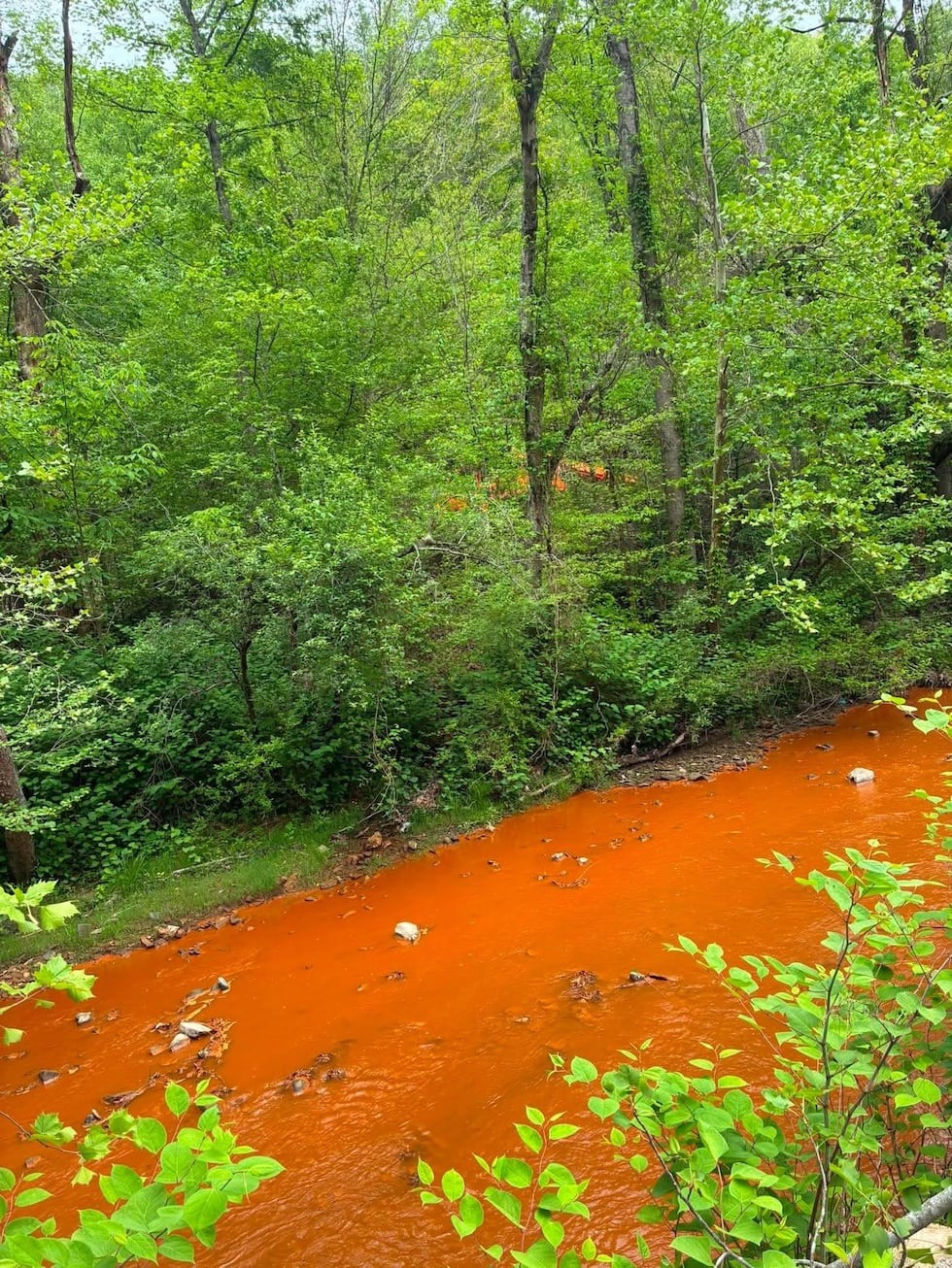 Several agencies investigating orange stream water