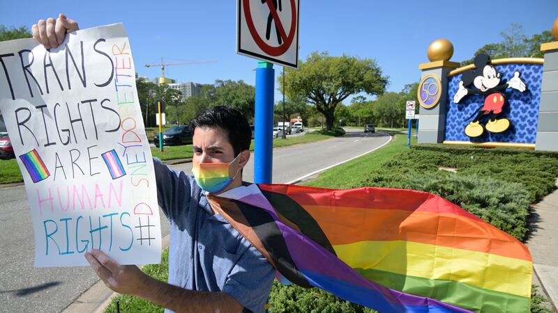 FILE - Disney cast member Nicholas Maldonado protests the company's stance on LGBTQ issues,...