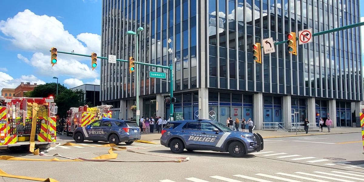 Busy road closed as fire crews, police investigate