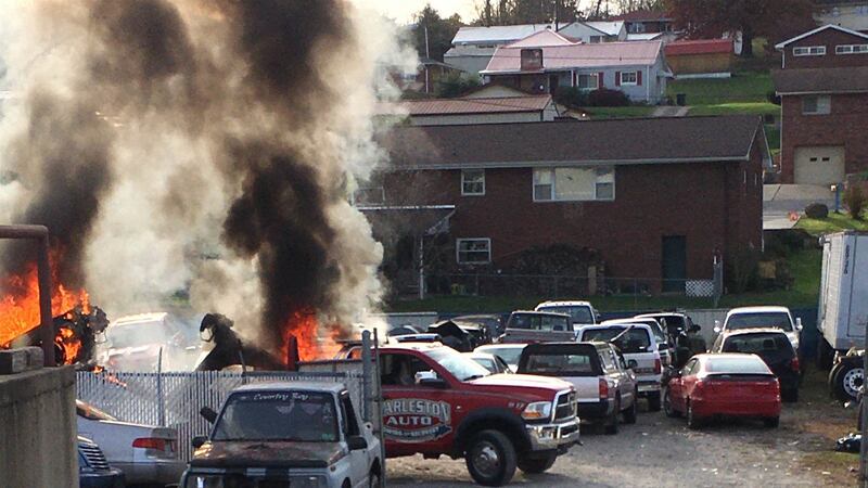 Two employees of Charleston Auto were injured Thursday when a vehicle caught fire.