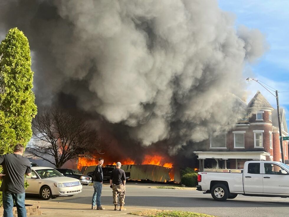 Crews fight a massive fire along Third Avenue in downtown Huntington.