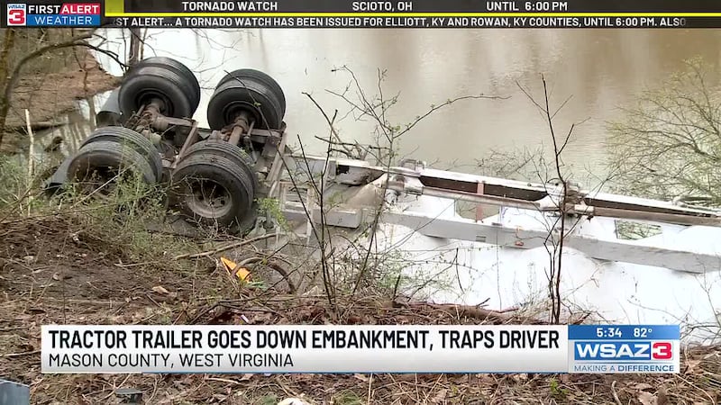 Officials say that driver was trapped in his truck for multiple hours while they worked to get...